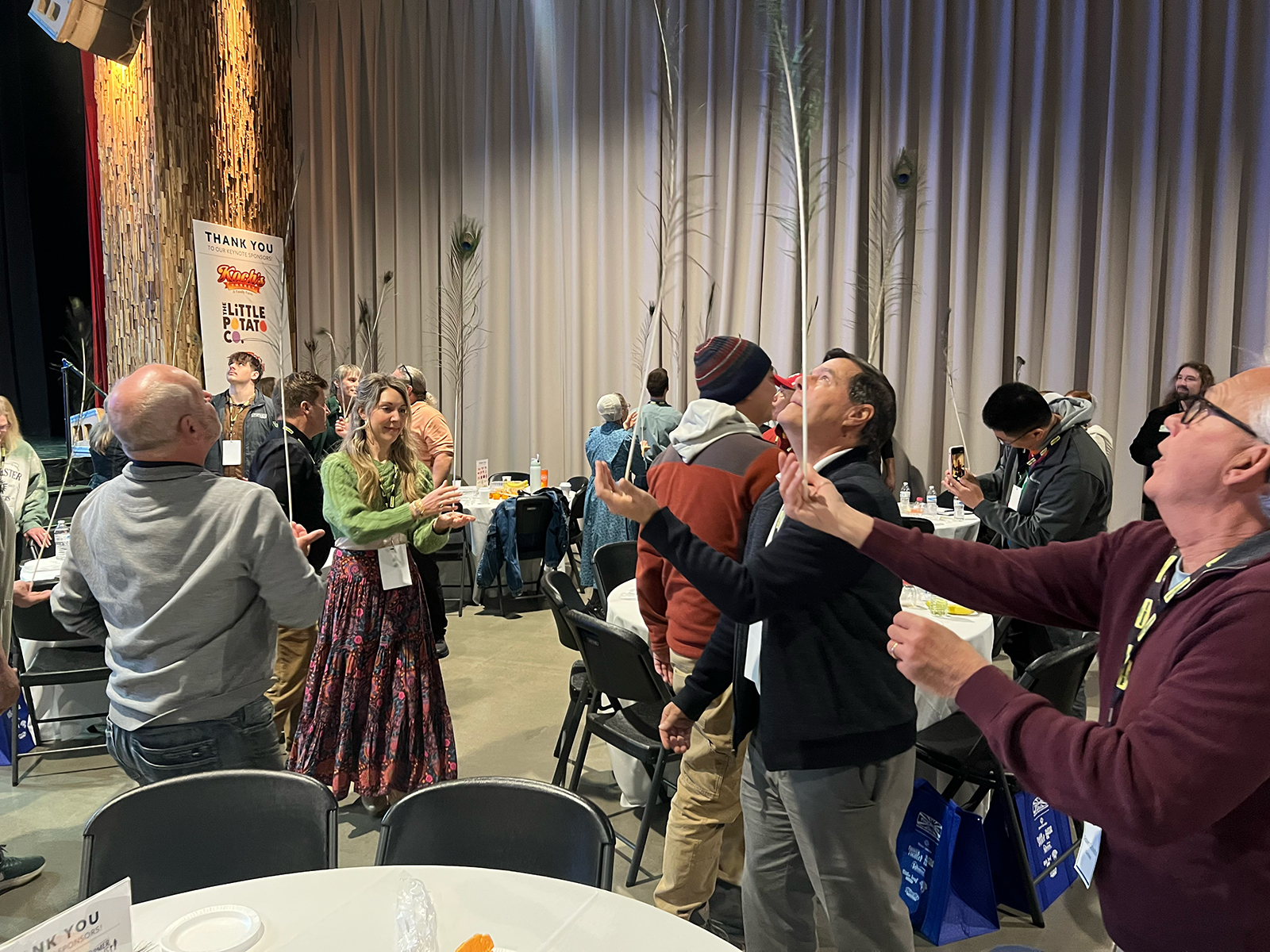 Fresh Fest attendees learned to adapt to imbalances in their lives by attempting to balance peacock quills during Keynote Speaker Dan Thurmon’s presentation.